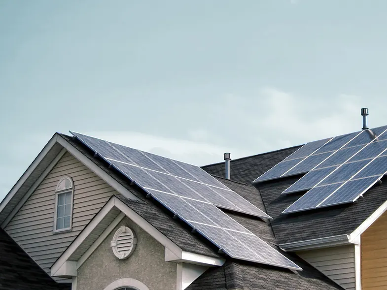 Suburban home with solar panels along the roofline